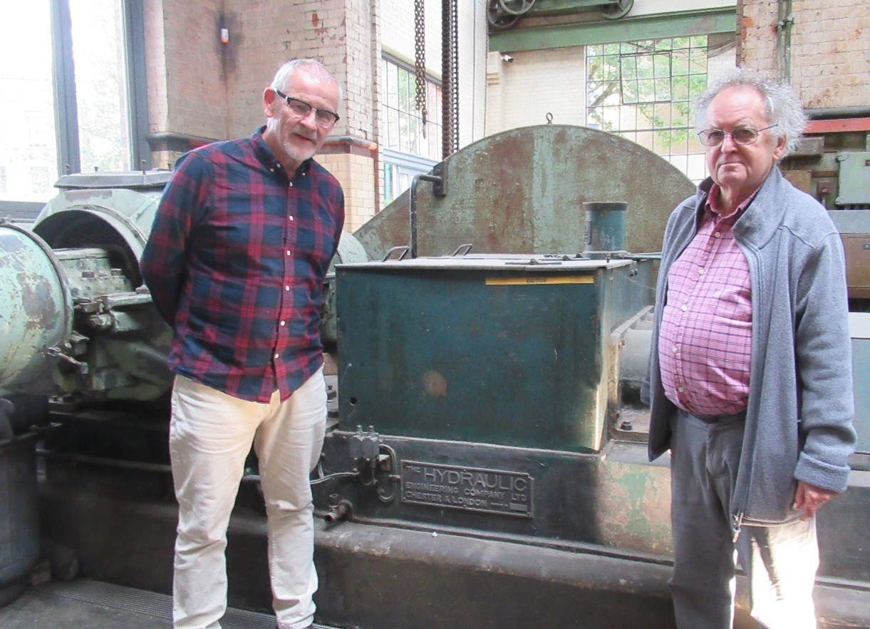 Gerard Donnachie and David Perrett in front of a surviving hydraulic pump, 6 June 2026